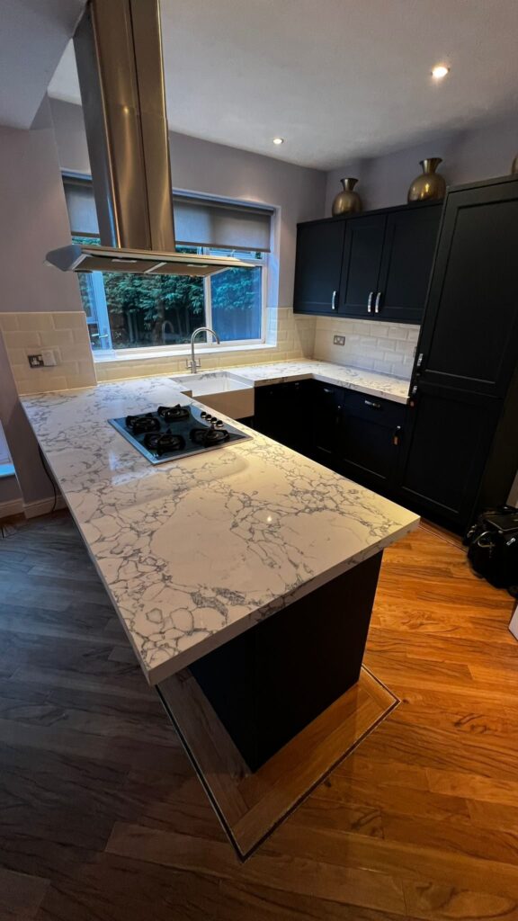 Modern Bolton kitchen with Horton Superior Matt Indigo doors and Bulgaria Dark quartz overlay worktops.