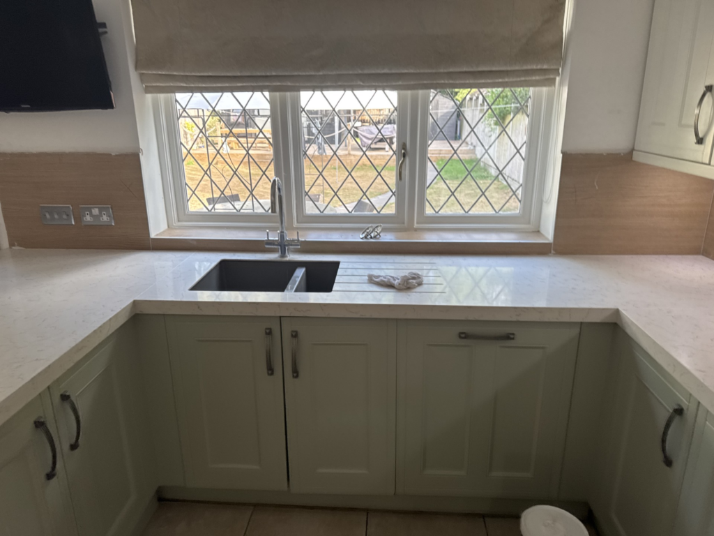 Modern Essex kitchen with Carrara Marble quartz overlay worktops and shaker doors after transformation